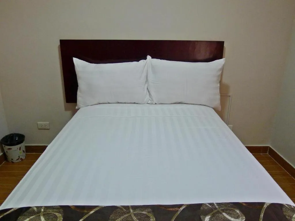 Bed in Rovic's Tourist Hotel
