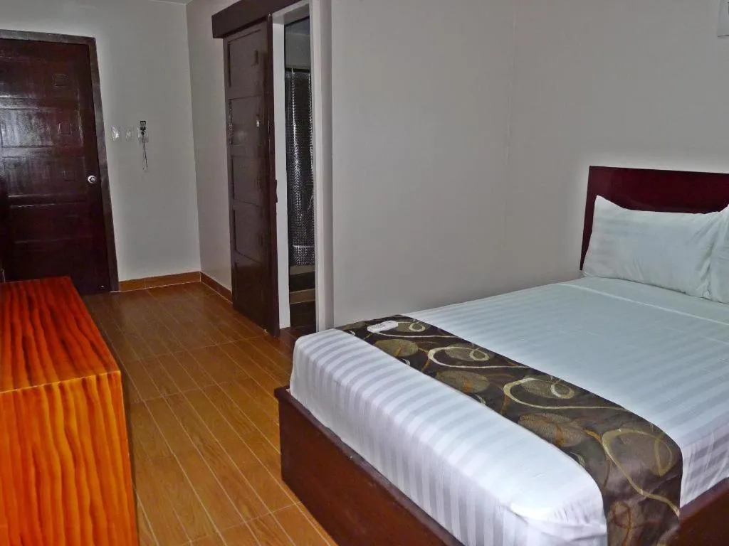 Bed in Rovic's Tourist Hotel