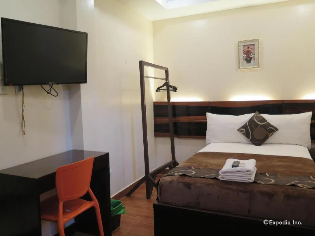 Bed in Rovic's Tourist Hotel