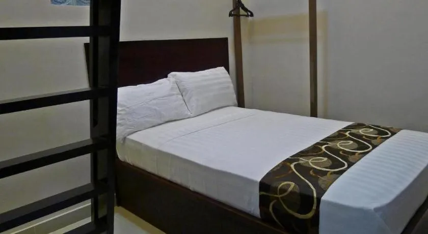 Bed in Rovic's Tourist Hotel