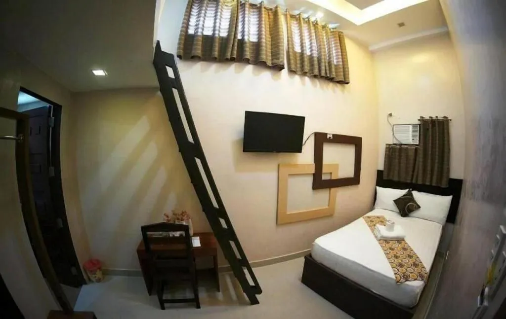 Bed in Rovic's Tourist Hotel