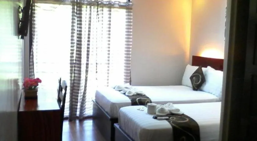 Bed in Rovic's Tourist Hotel