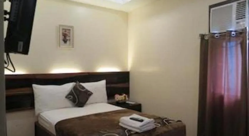 Bed in Rovic's Tourist Hotel