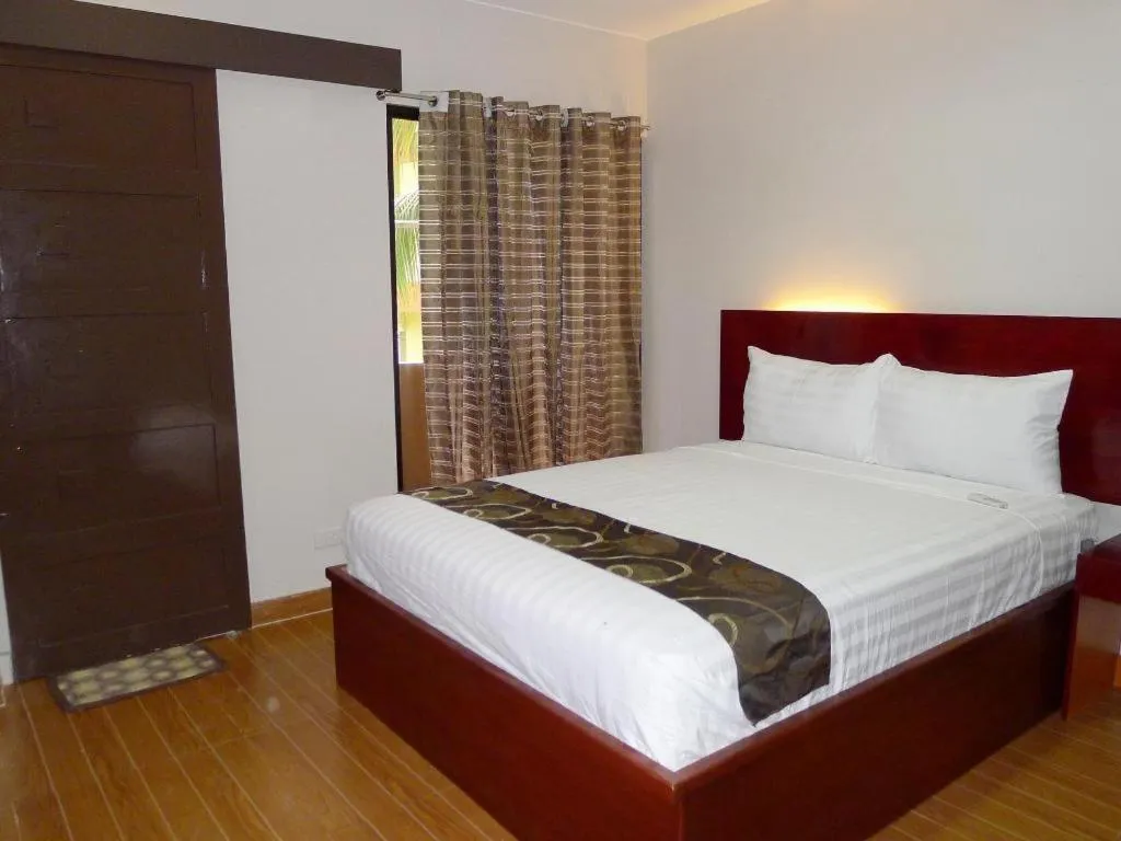 Bed in Rovic's Tourist Hotel