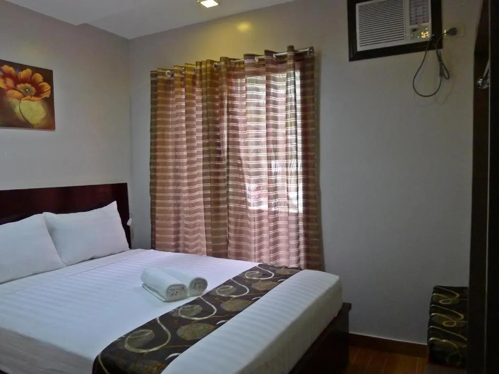 Bed in Rovic's Tourist Hotel