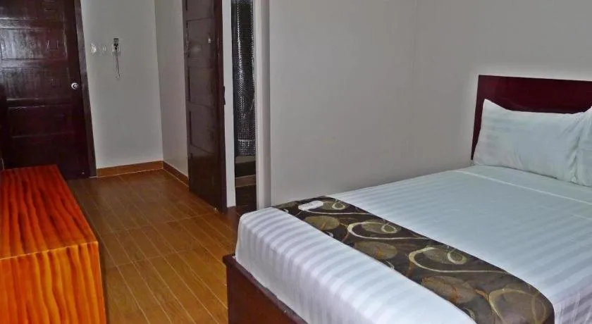 Bed in Rovic's Tourist Hotel
