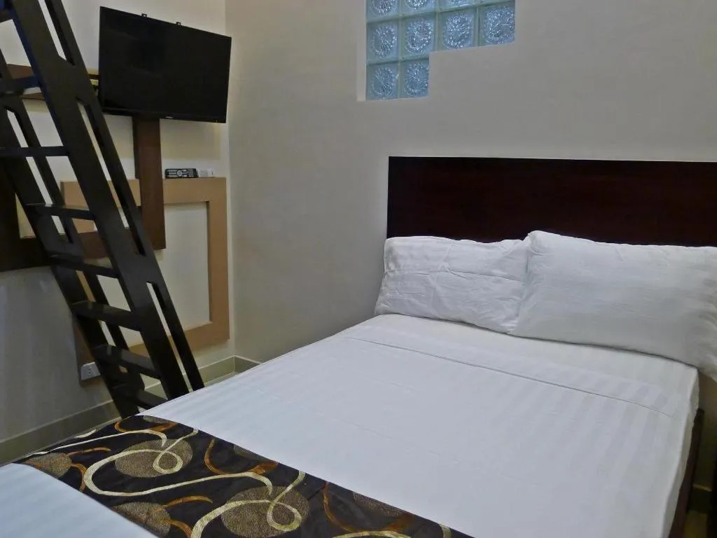 Bed in Rovic's Tourist Hotel