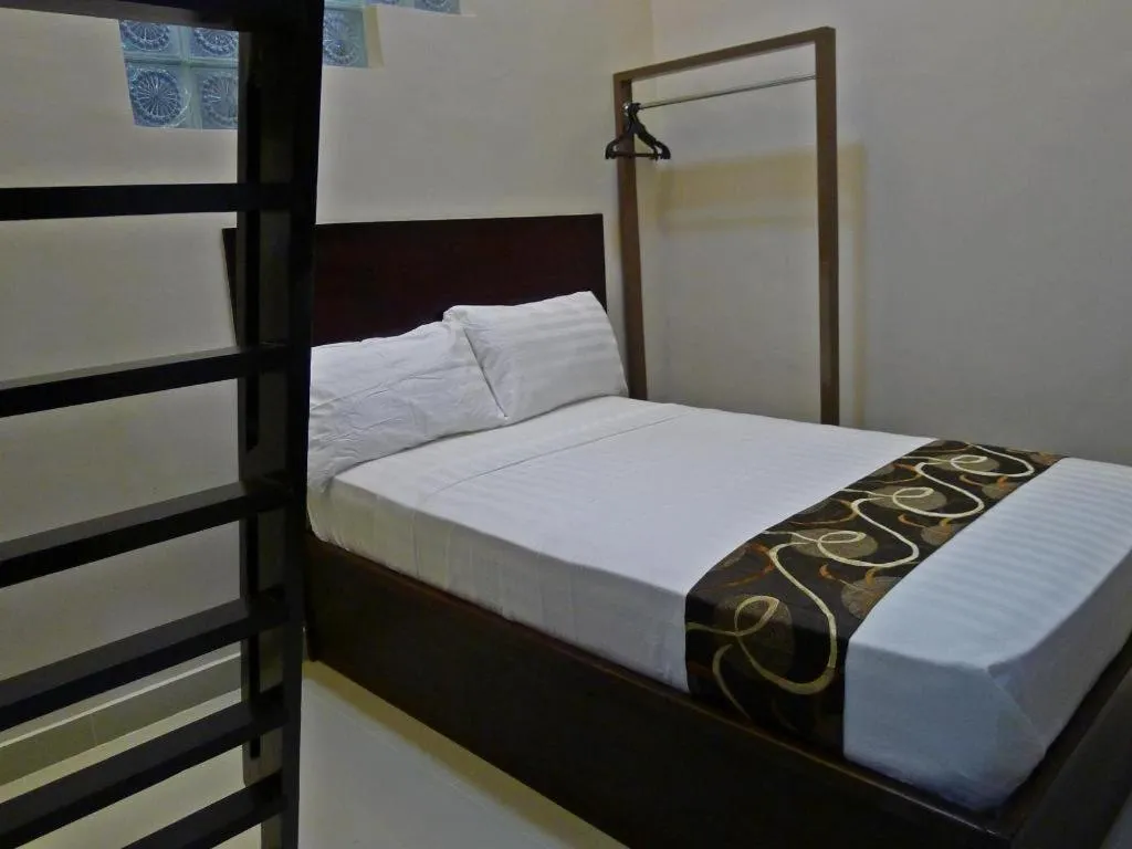 Bed in Rovic's Tourist Hotel