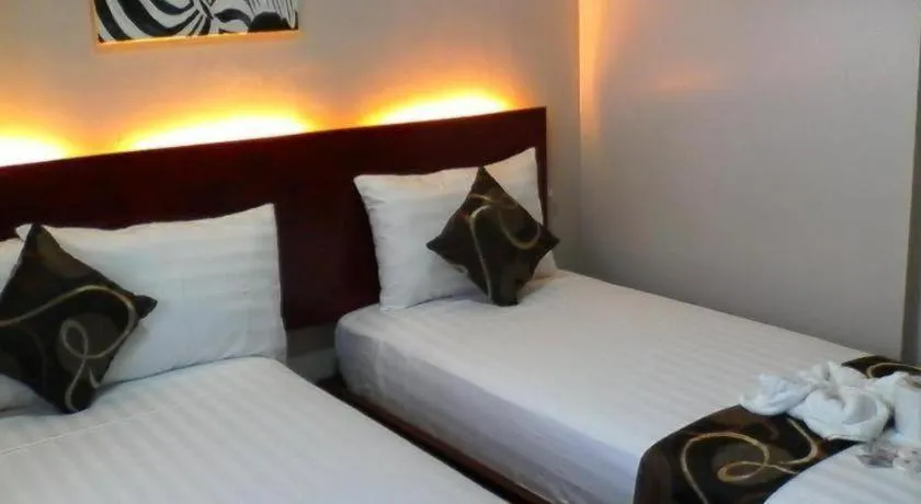 Bed in Rovic's Tourist Hotel