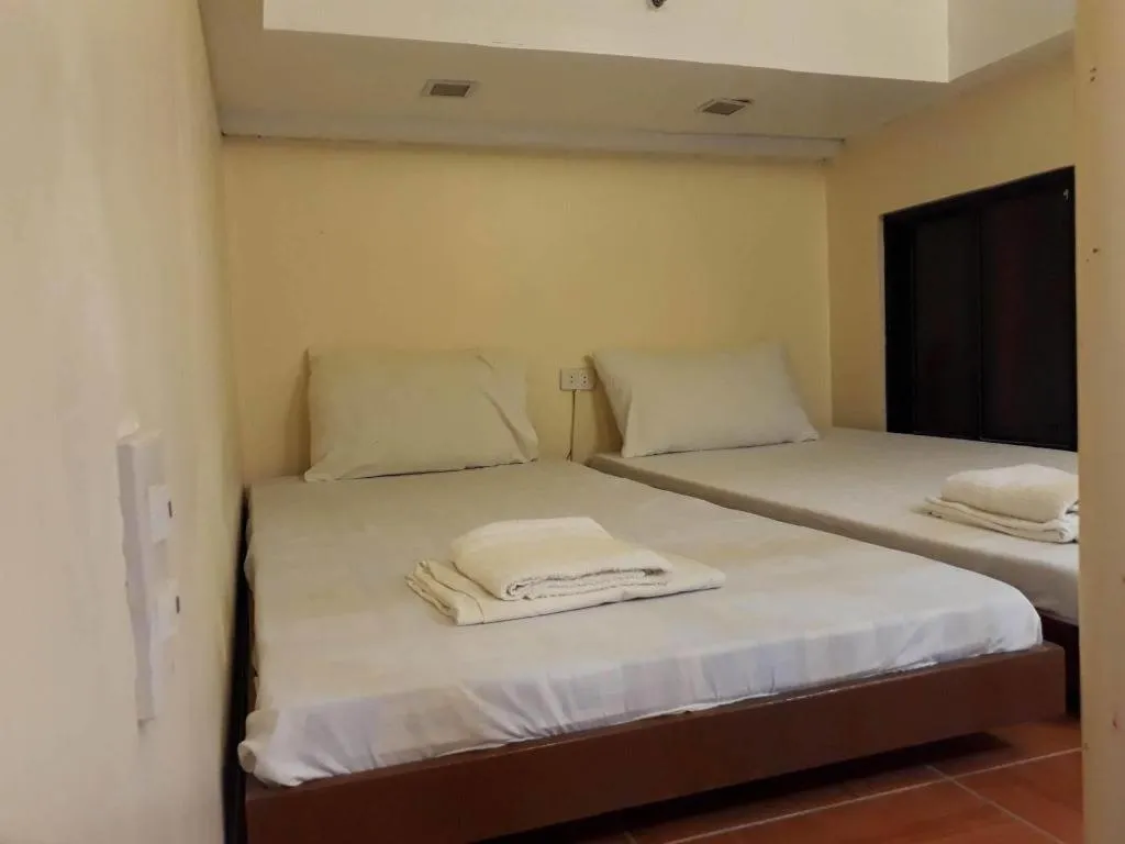 Bed in Rovic's Tourist Hotel