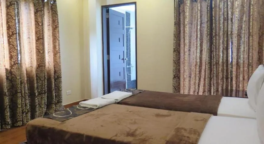 Bed in Rovic's Tourist Hotel