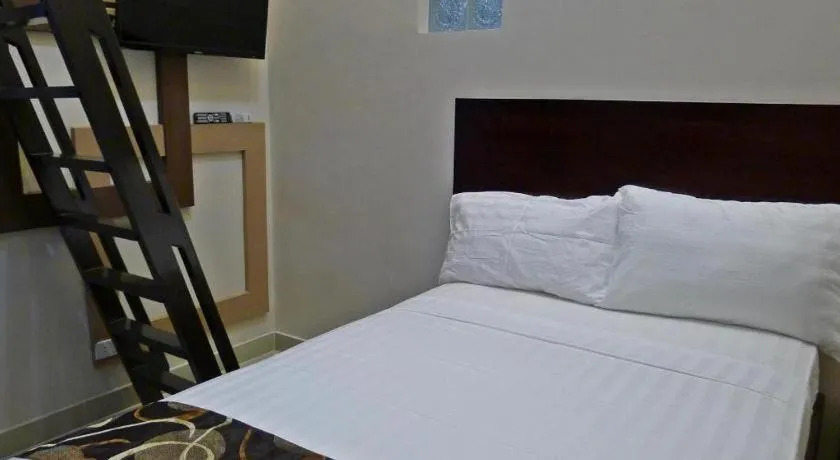 Bed in Rovic's Tourist Hotel