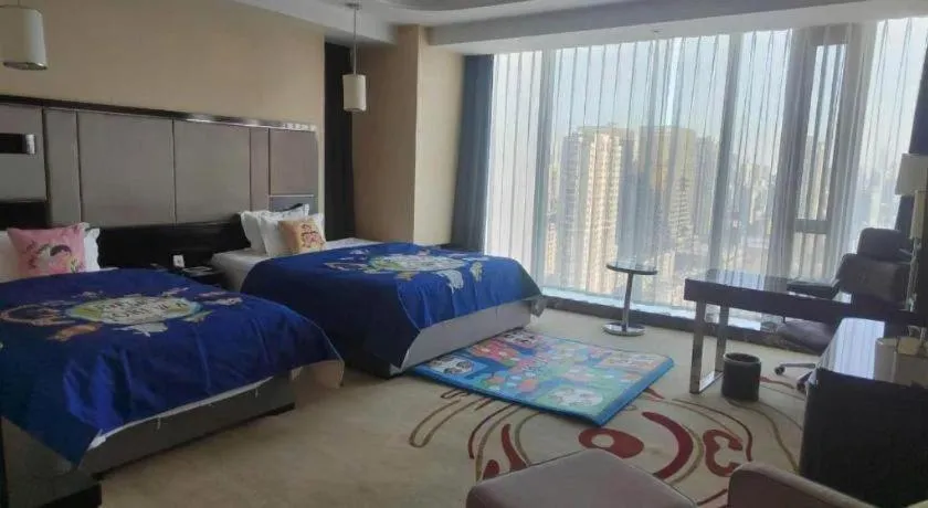 Bed in Pacific Regency Hotel Shenyang