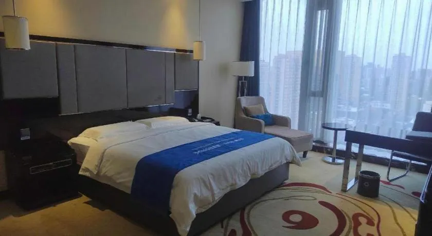 Bed in Pacific Regency Hotel Shenyang