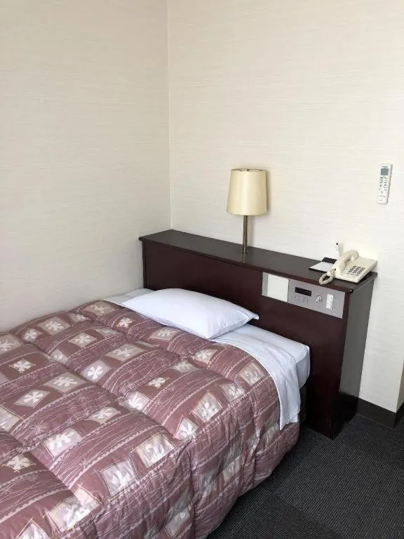 Bed in Hotel Town Nishikigawa