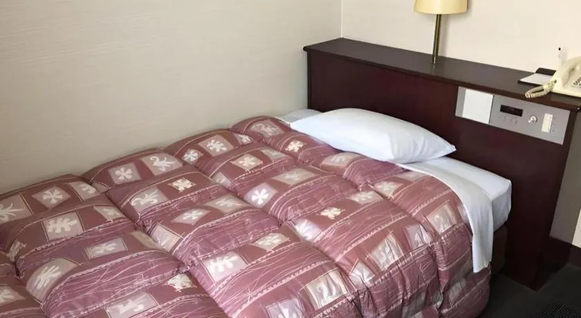 Bed in Hotel Town Nishikigawa