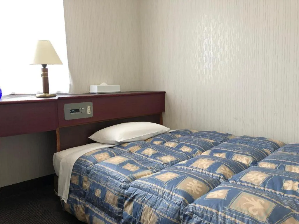 Bed in Hotel Town Nishikigawa