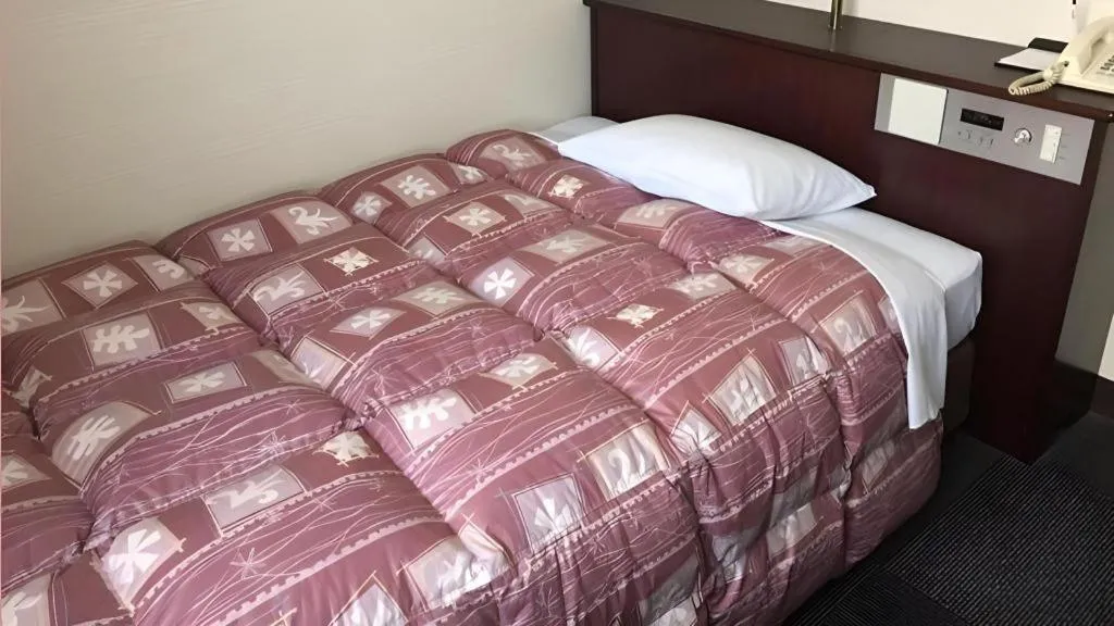 Bed in Hotel Town Nishikigawa