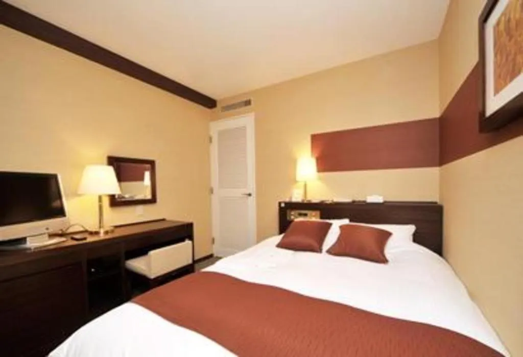 Bed in Welcome Hotel Kochi