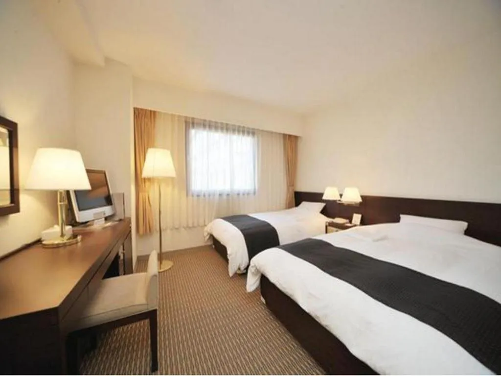 Bed in Welcome Hotel Kochi