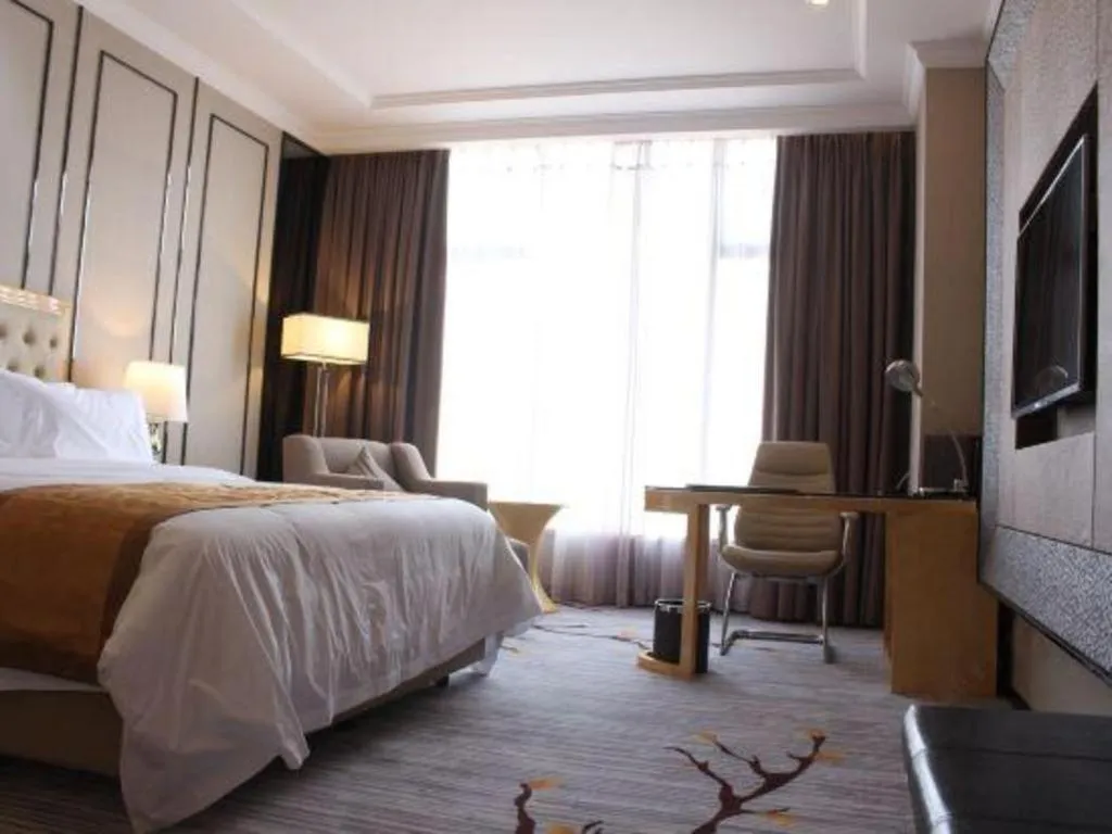 Bed in Golden Phoenix International Hotel