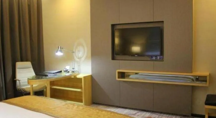 Bed in Golden Phoenix International Hotel