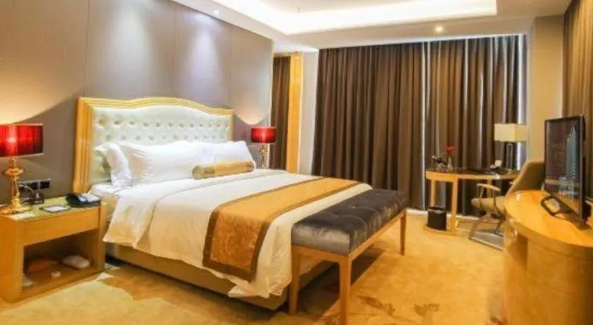 Bed in Golden Phoenix International Hotel