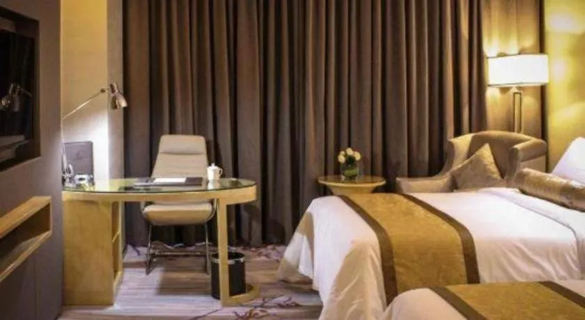 Bed in Golden Phoenix International Hotel