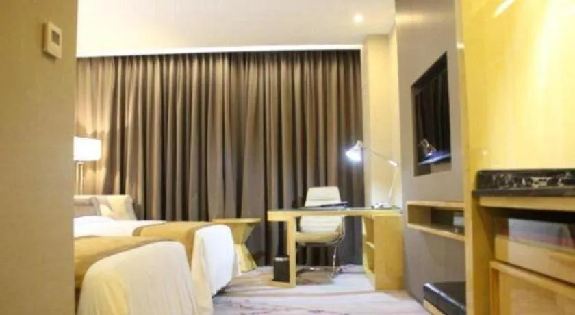 Bed in Golden Phoenix International Hotel