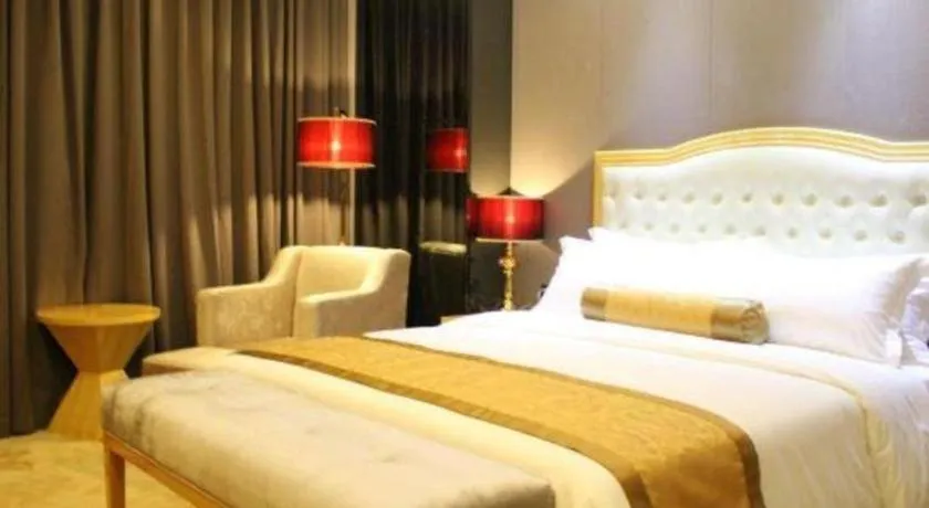 Bed in Golden Phoenix International Hotel