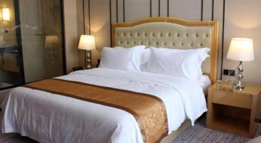 Bed in Golden Phoenix International Hotel