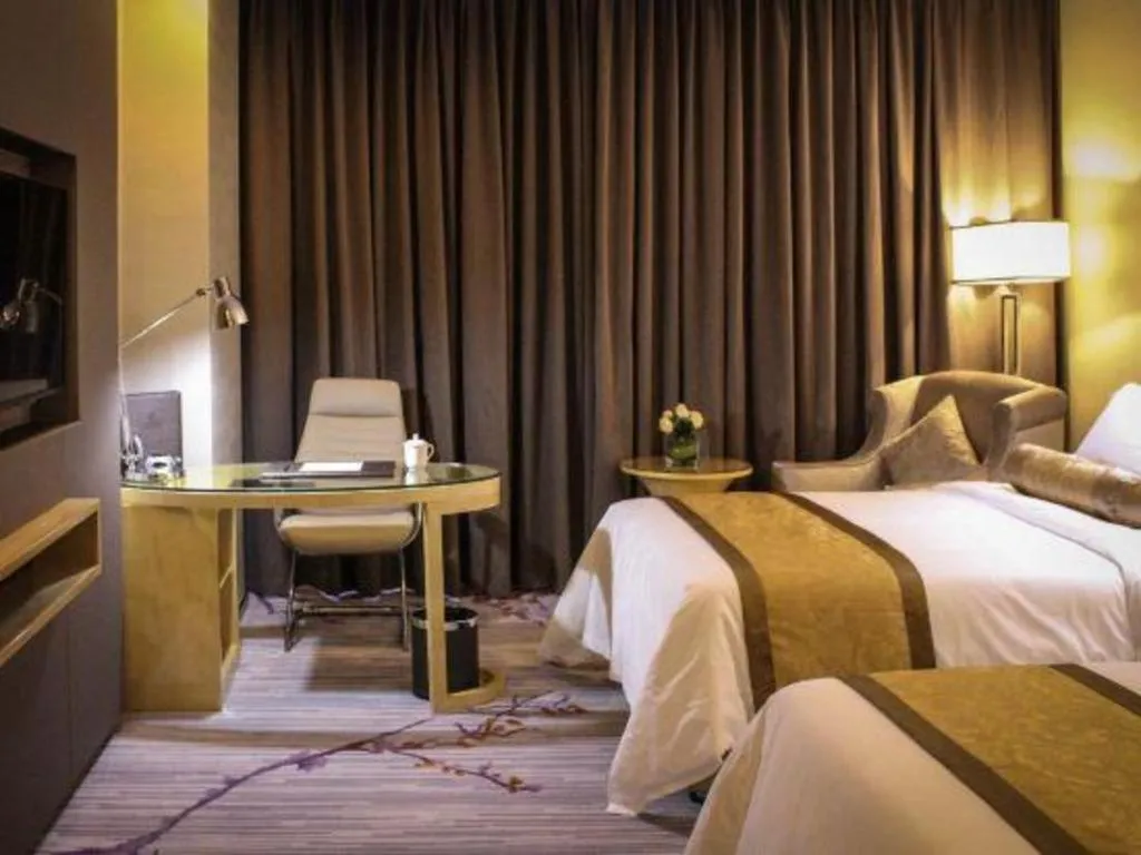 Bed in Golden Phoenix International Hotel