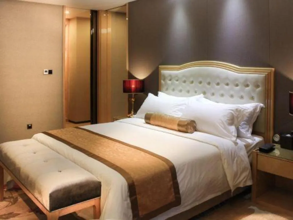 Bed in Golden Phoenix International Hotel