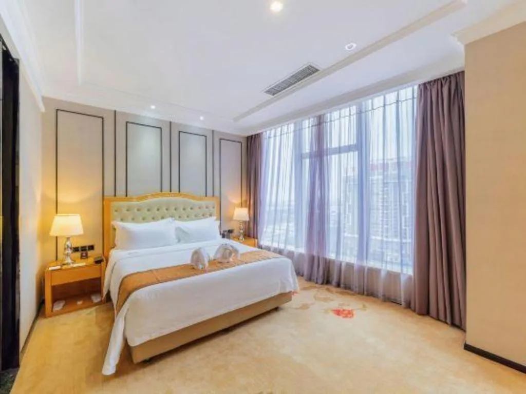 Bed in Golden Phoenix International Hotel