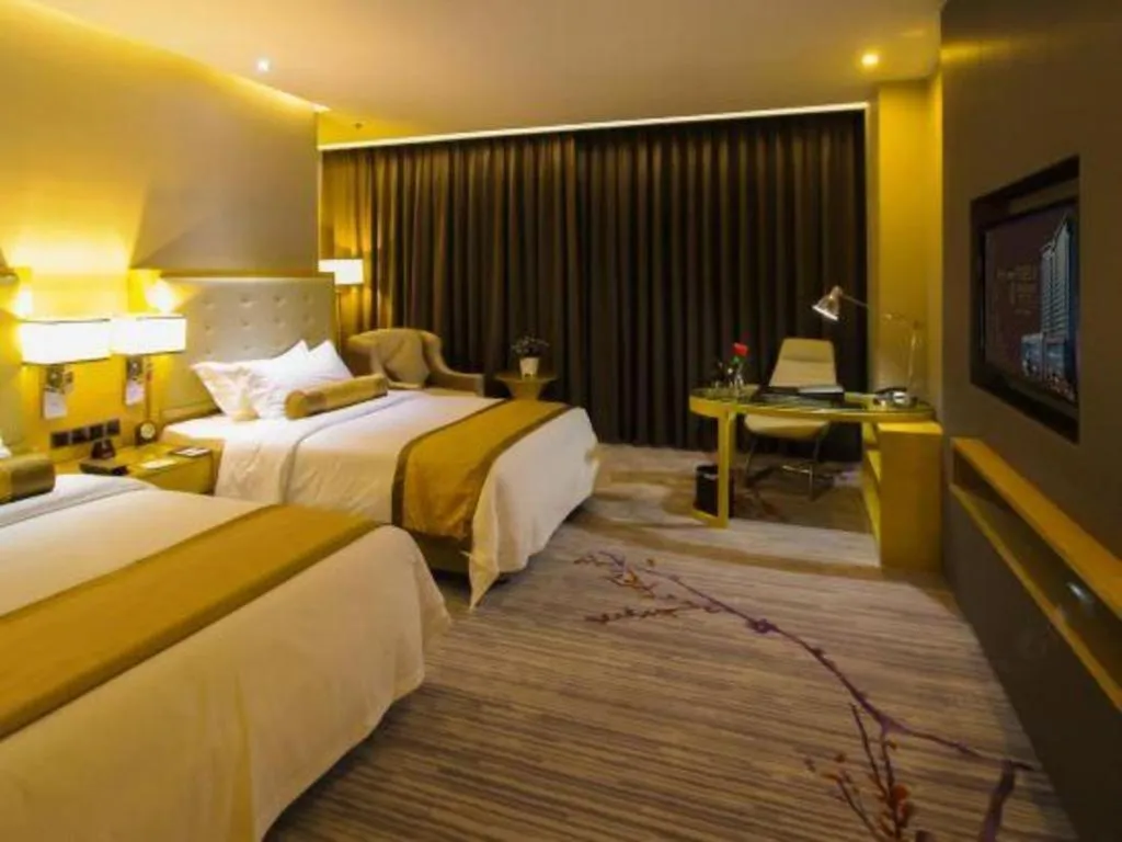 Bed in Golden Phoenix International Hotel