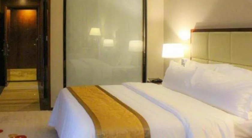 Bed in Golden Phoenix International Hotel