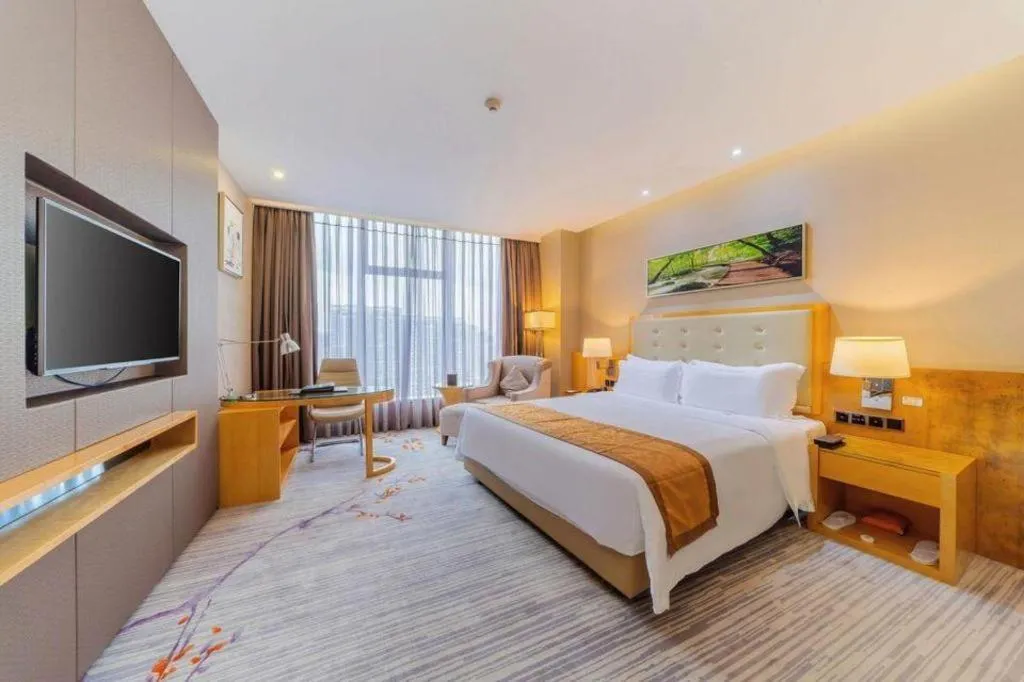 Bed in Golden Phoenix International Hotel