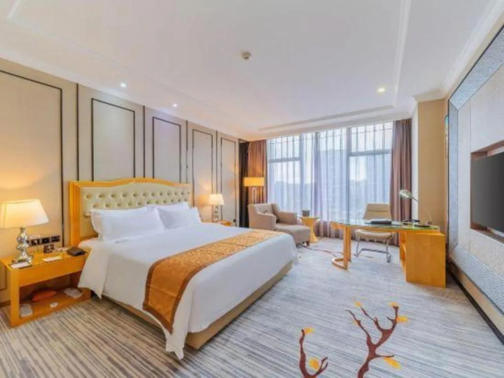 Bed in Golden Phoenix International Hotel