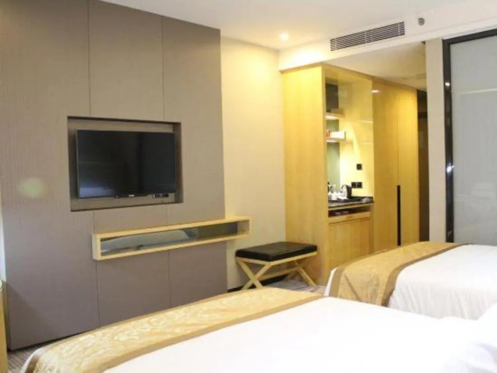 Bed in Golden Phoenix International Hotel