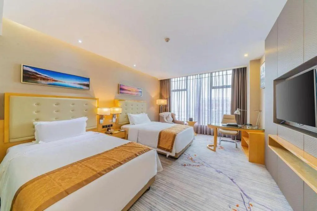 Bed in Golden Phoenix International Hotel