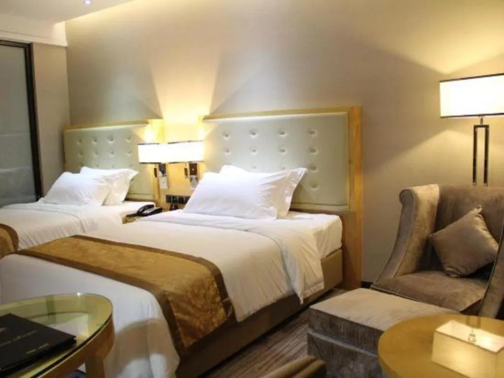 Bed in Golden Phoenix International Hotel