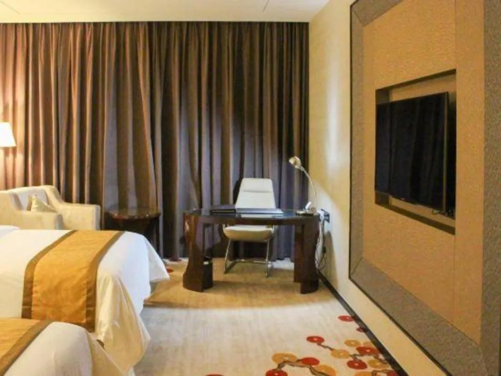 Bed in Golden Phoenix International Hotel