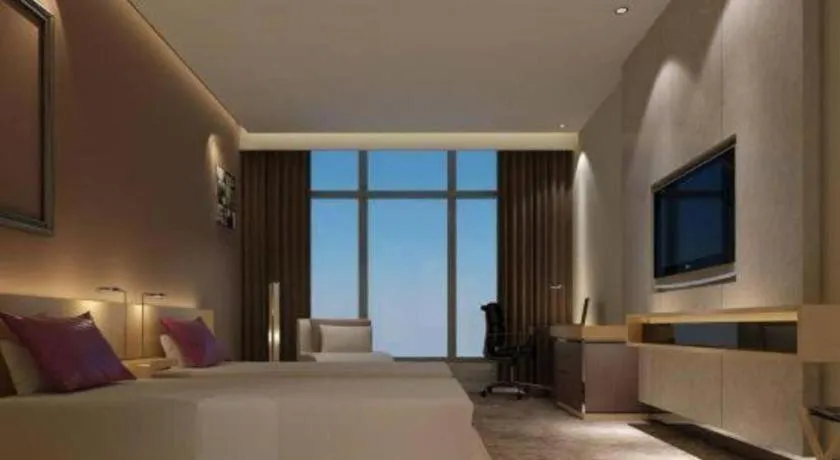 Bed in Golden Phoenix International Hotel