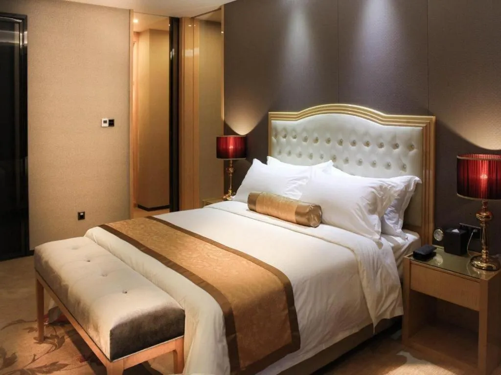 Bed in Golden Phoenix International Hotel