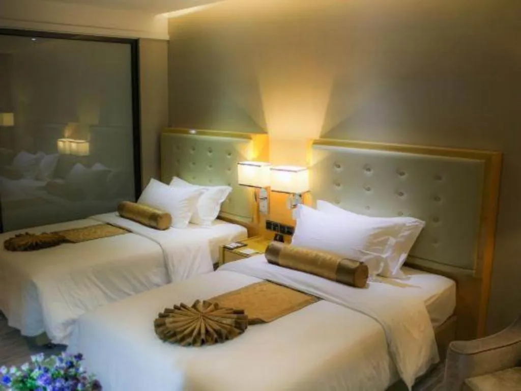 Bed in Golden Phoenix International Hotel