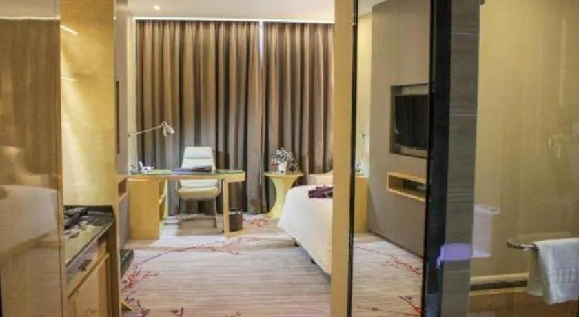 Bed in Golden Phoenix International Hotel