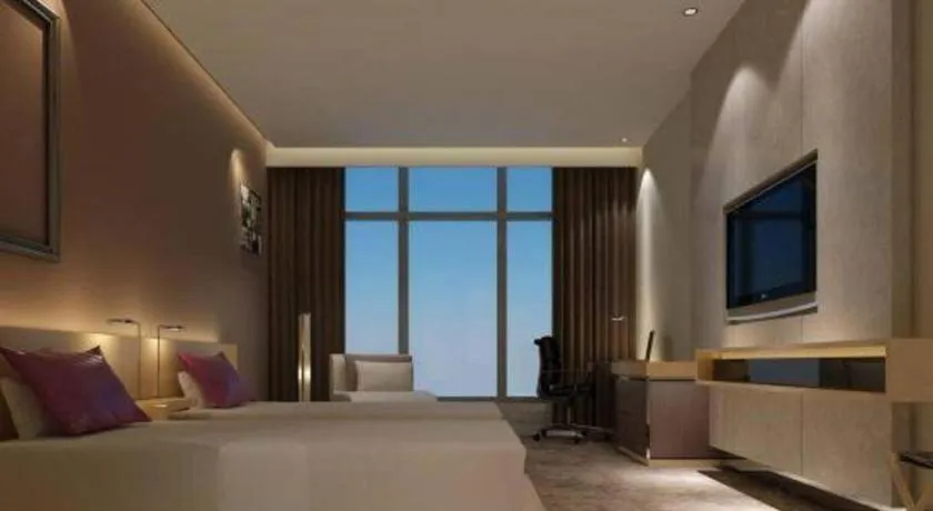 Bed in Golden Phoenix International Hotel