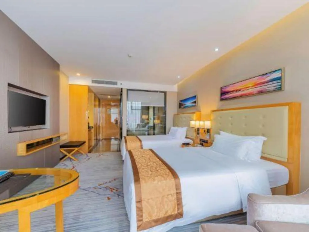 Bed in Golden Phoenix International Hotel