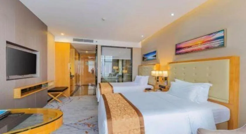 Bed in Golden Phoenix International Hotel