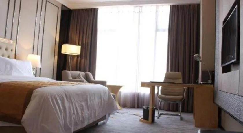 Bed in Golden Phoenix International Hotel